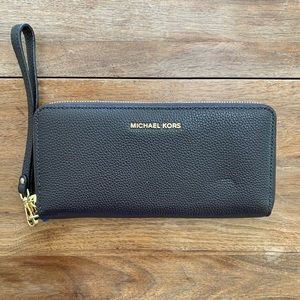 Michael Kors | Brown leather wristlet.